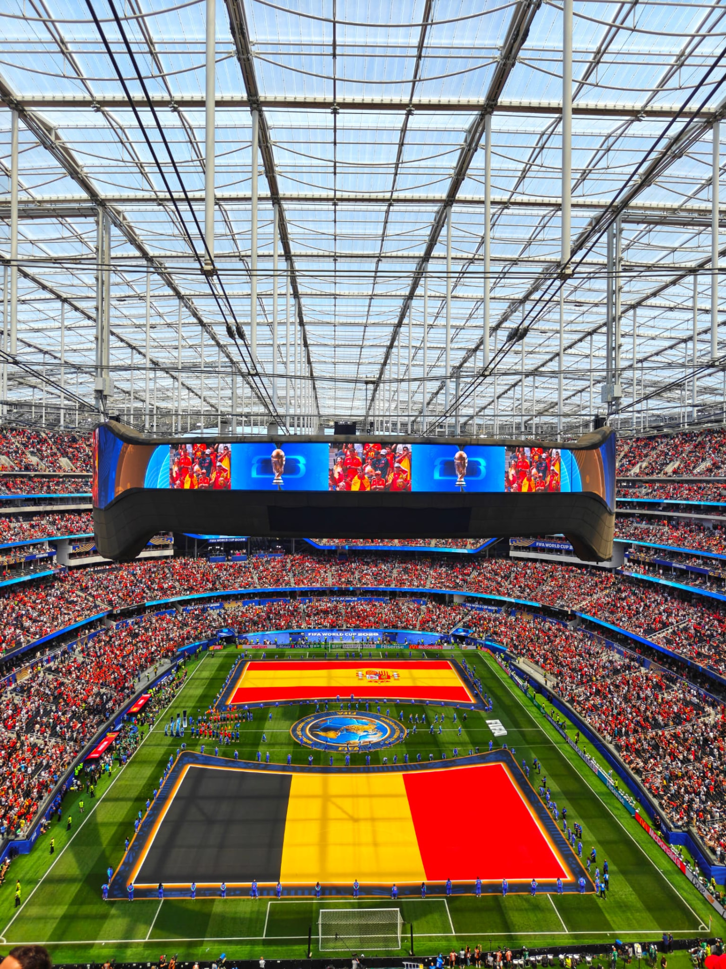 Opening ceremony flags of Spain and Belgium laid across the pitch at the 2026 FIFA World Cup